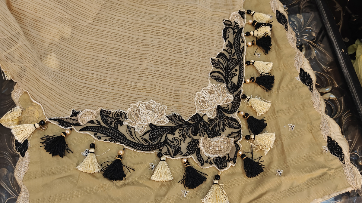 Beige zari dupatta with black and off white floral corner embroidery patch and handmade black and cream tassels with pearls by Hashtag Happiness Faisalabad