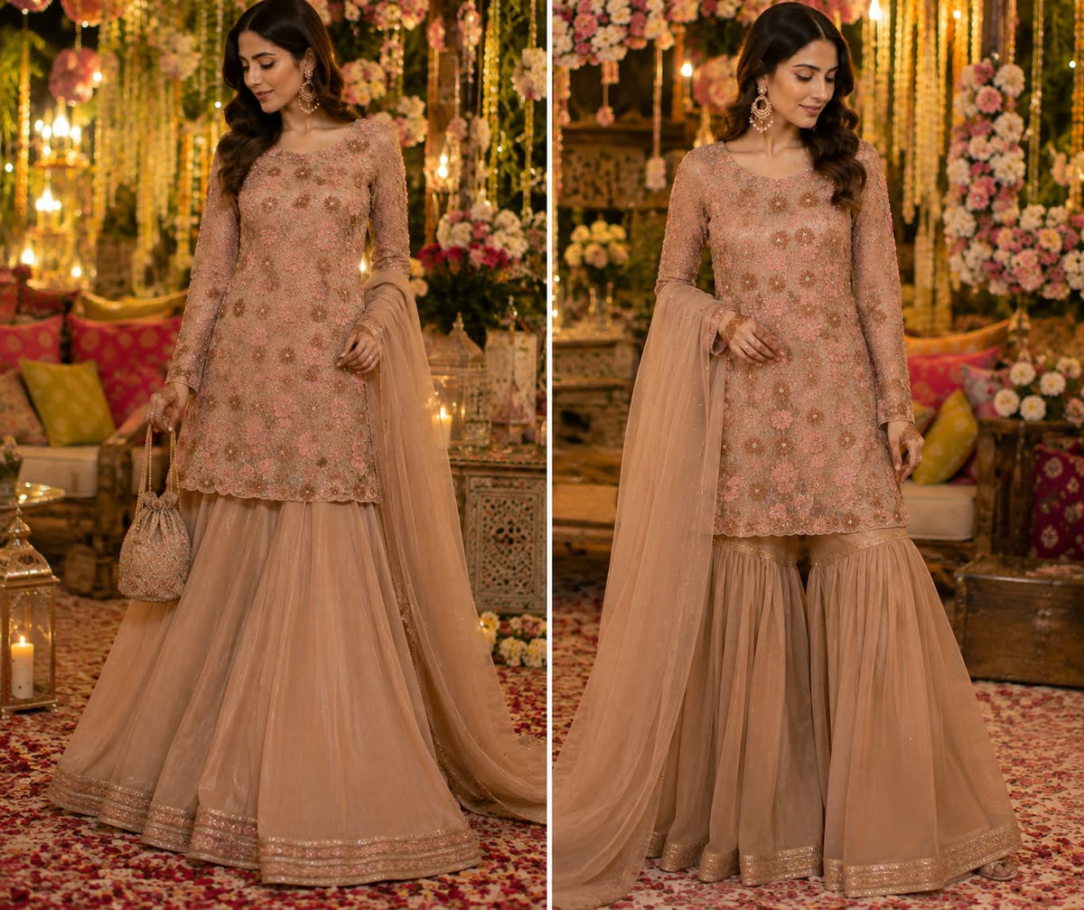 Heavy peach embroidered short shirt with full flair sharara and net dupatta for mehndi event - bespoke stitching