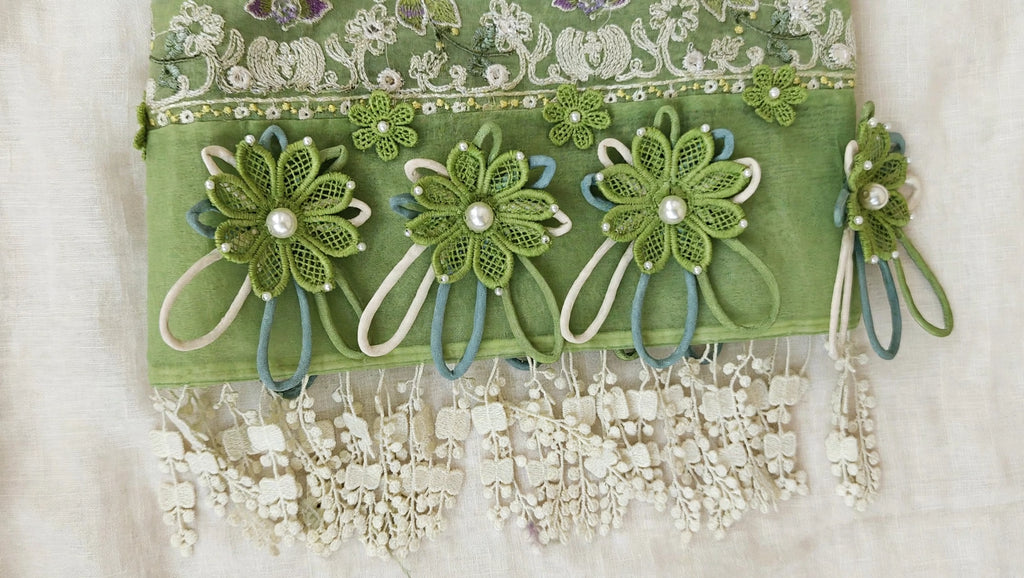 : Luxury designer sleeves design with three handmade green crochet flowers with pearls and organza embroidery closeup