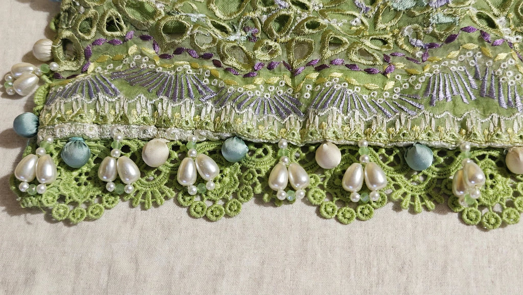 Suffuse inspired premium daman design with white floral lace, green crochet flowers and heavy pearl embellishment custom stitched by Hashtag Happiness Faisalabad