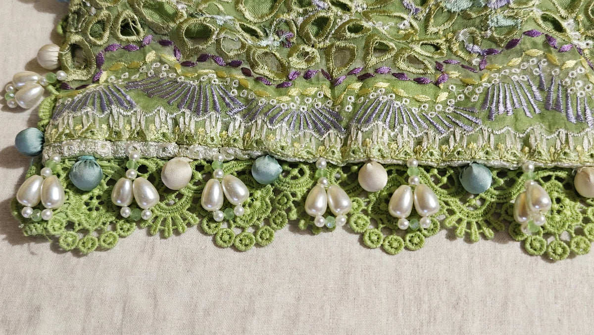 Suffuse inspired premium daman design with white floral lace, green crochet flowers and heavy pearl embellishment custom stitched by Hashtag Happiness Faisalabad