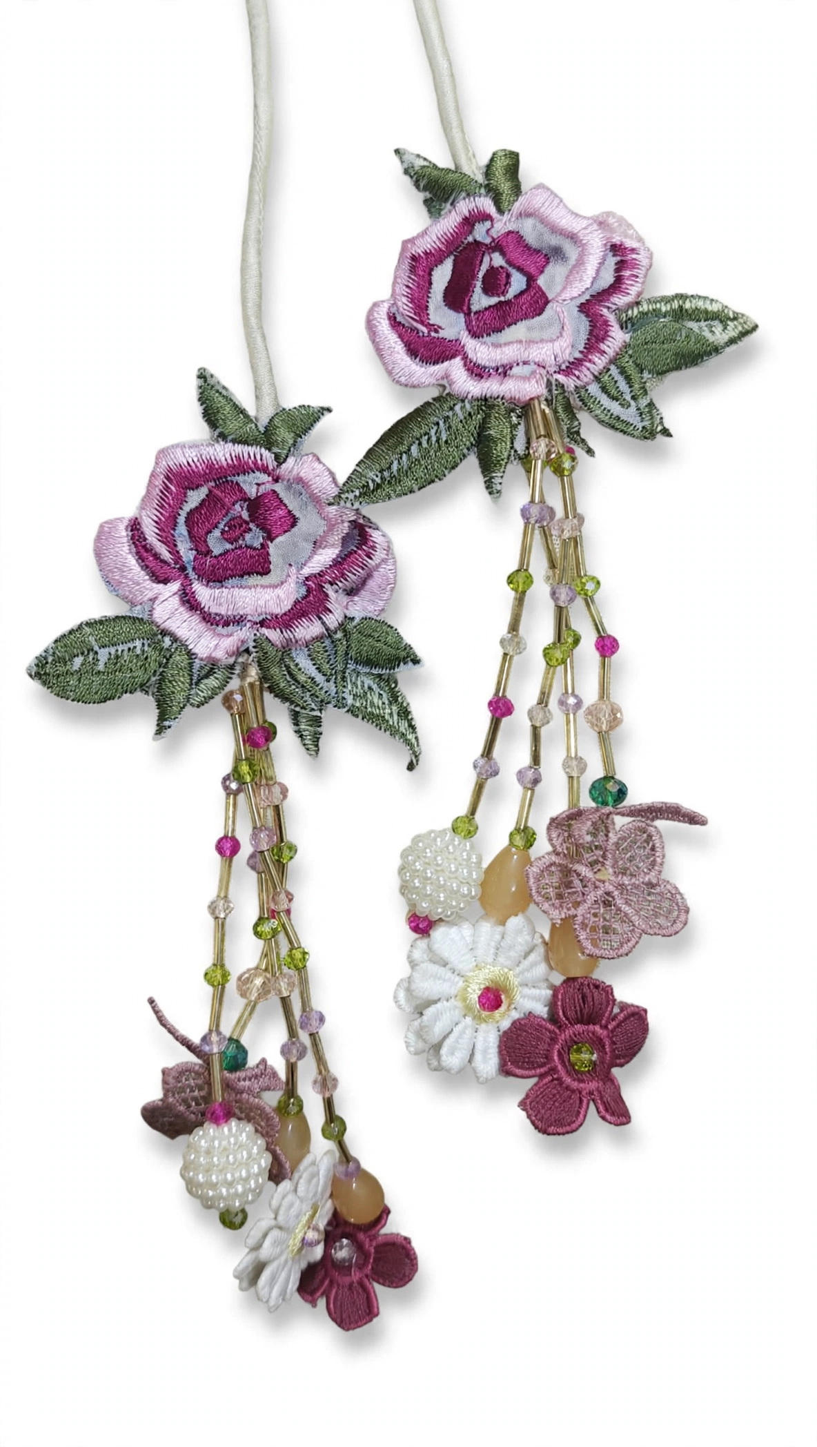 Handmade pink embroidered rose tassels with beaded latkan for dress dori and dupatta corners made by Hashtag Happiness stitching unit as part of bespoke stitching service not for individual sale